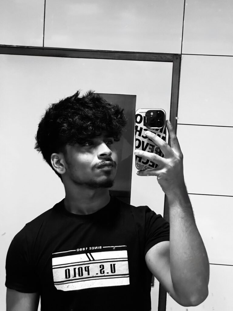 **Alt text:** “Freelance digital marketer in Calicut taking a stylish black-and-white mirror selfie with a smartphone.”